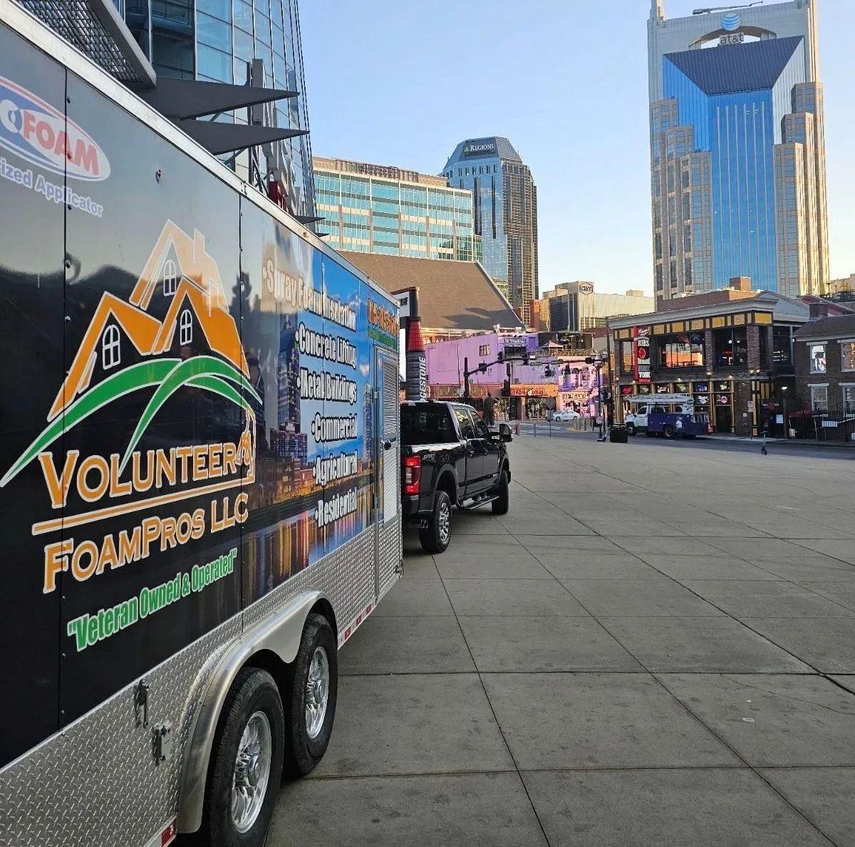 The Volunteer FoamPros truck and branded spray foam trailer on a commercial job in downtown Nashville, Tennessee