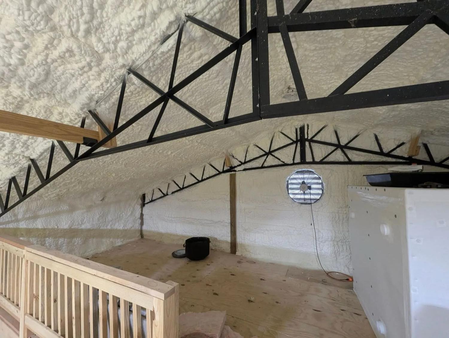 Spray foam insulation across the roof of a commercial metal building in Middle Tennessee