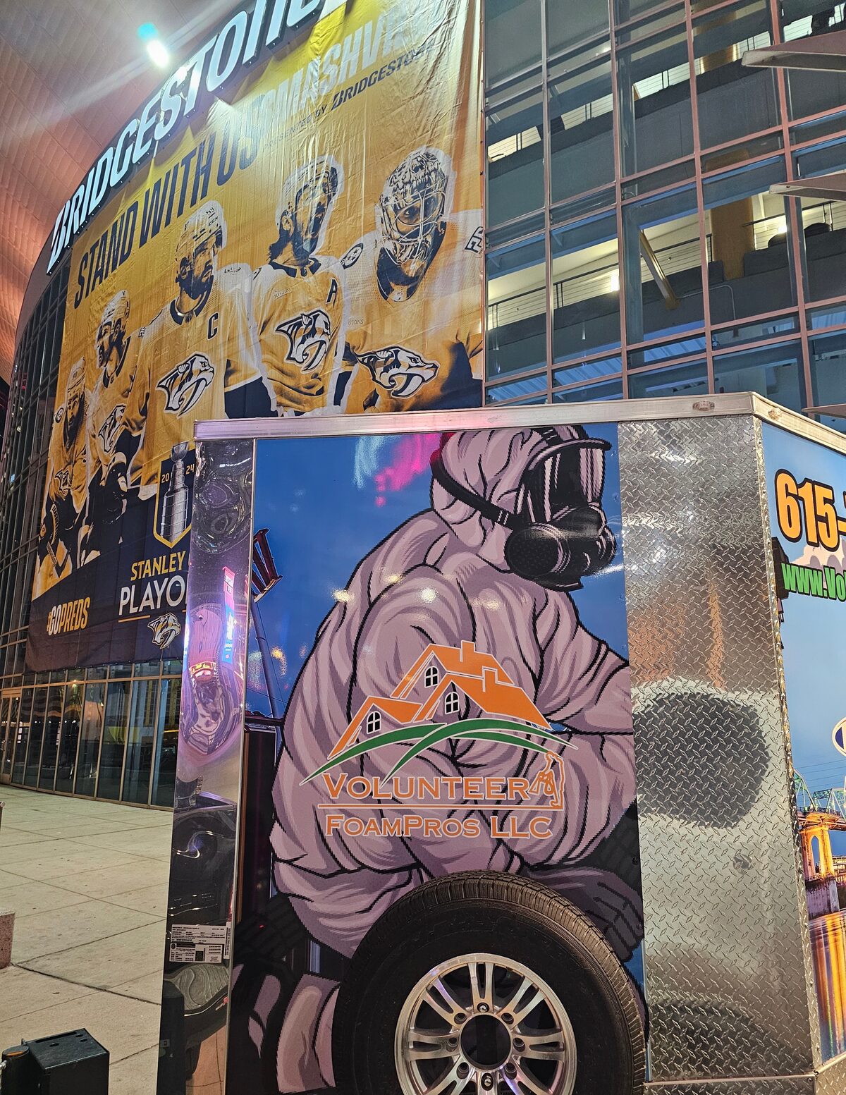 The Volunteer FoamPros spray foam trailer parked outside Bridgestone Arena in downtown Nashville