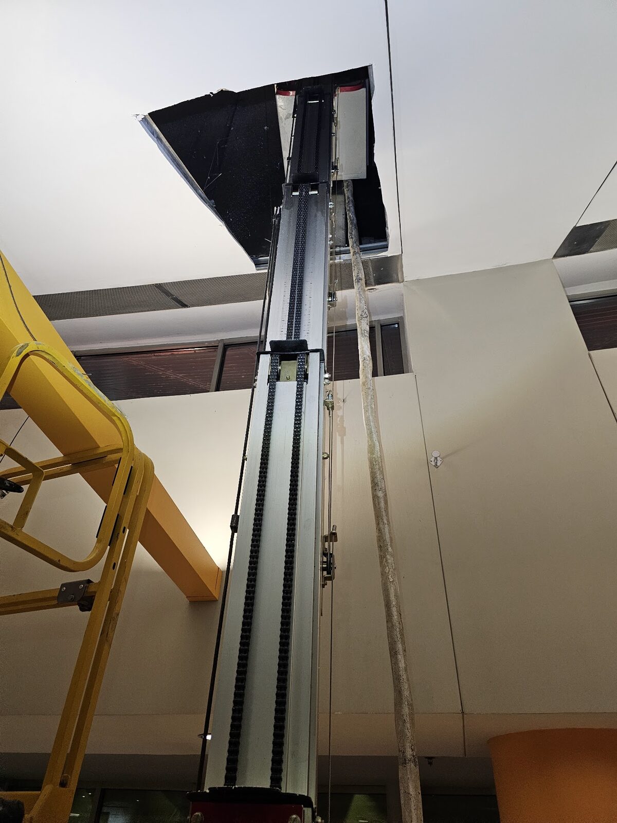 Ceiling access opened up above a lift during the Bridgestone Arena insulation project in Nashville