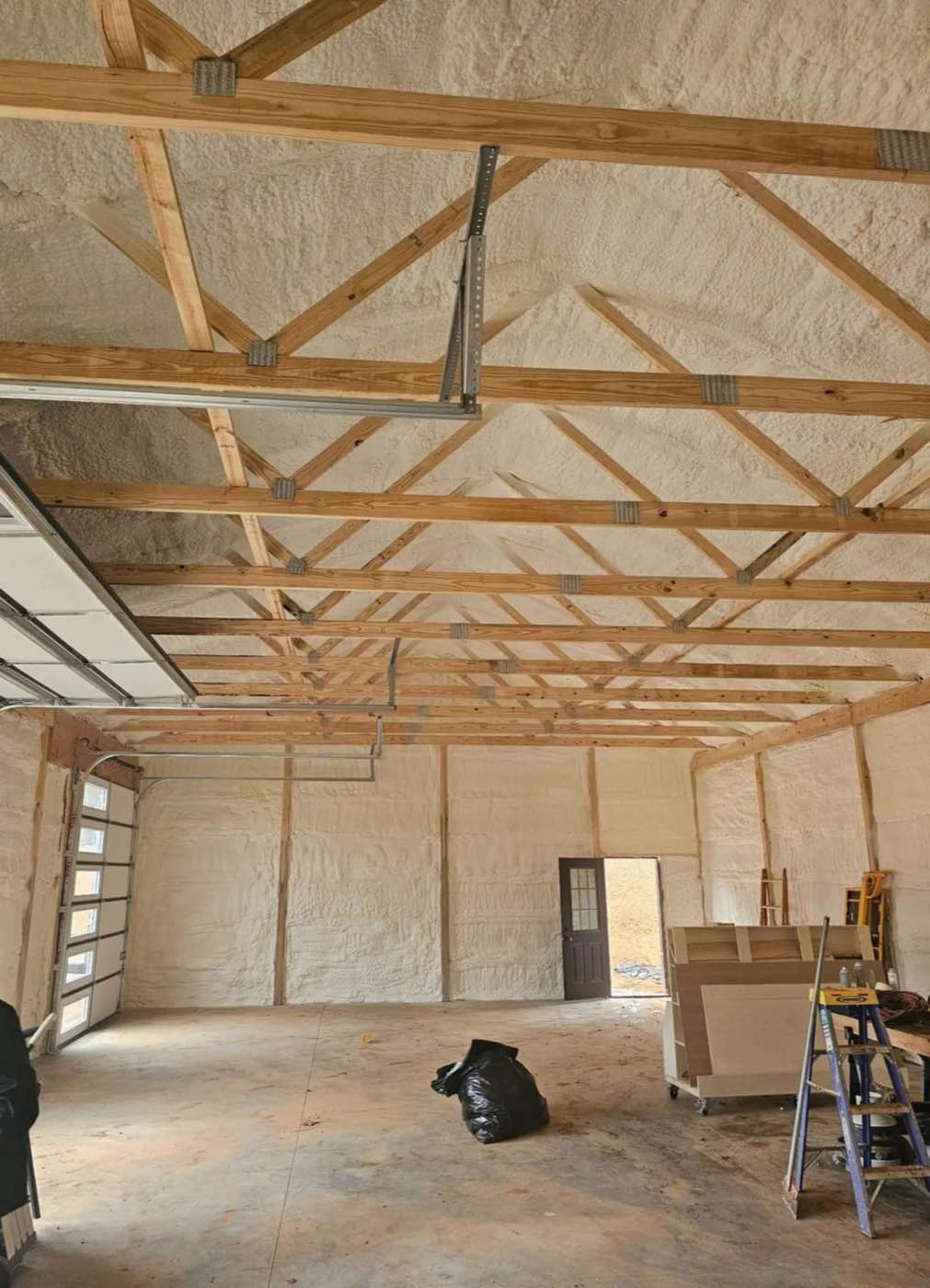 Roof framing insulated with spray foam in a new build