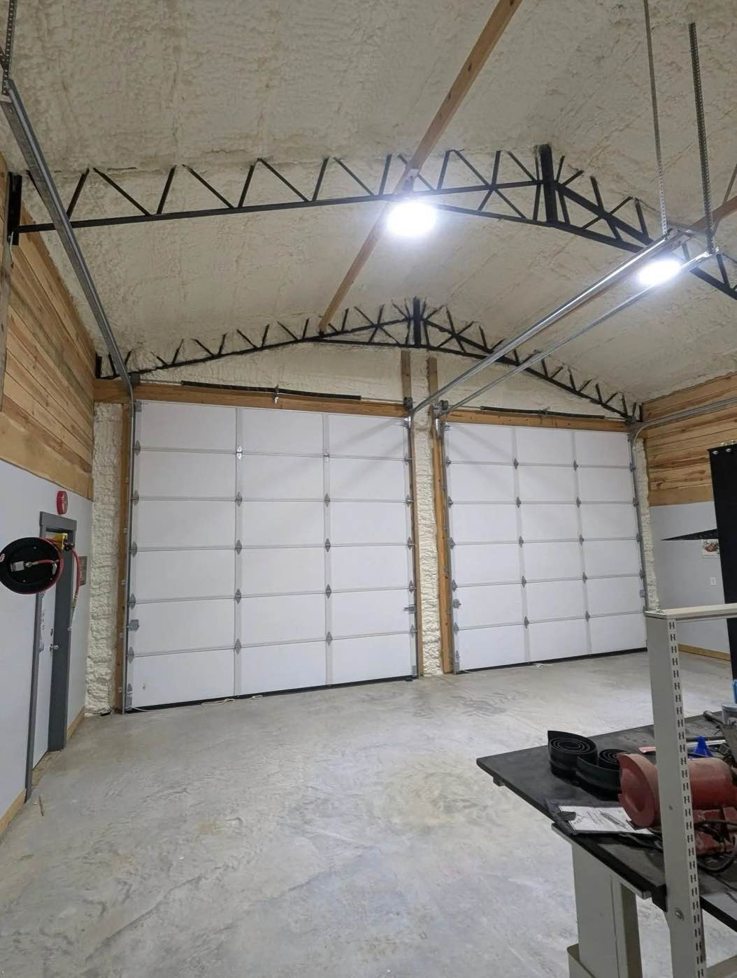 Finished spray foam insulation inside a shop building